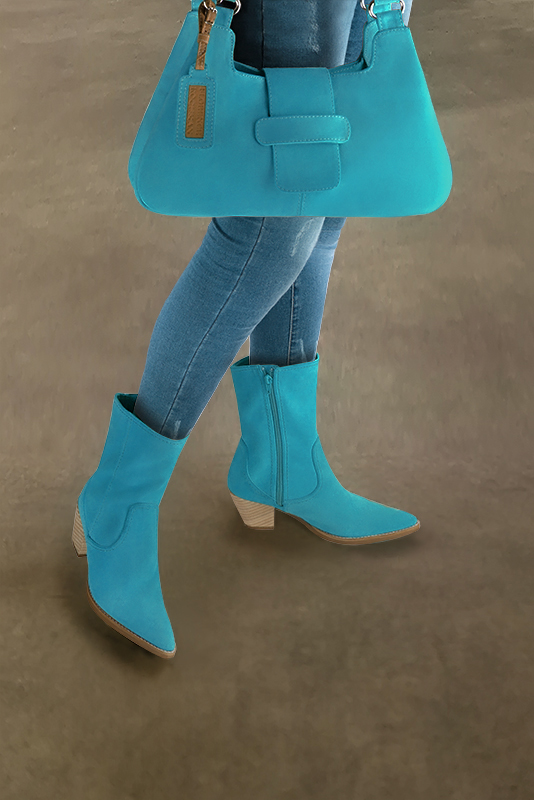 Turquoise blue women's ankle boots with a zip on the inside. Tapered toe. Medium cone heels. Worn view - Florence KOOIJMAN